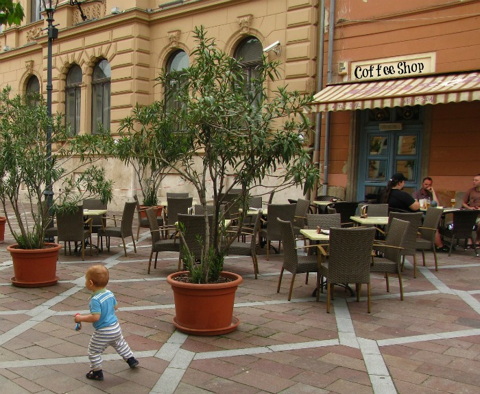 Child running at a coffee shop