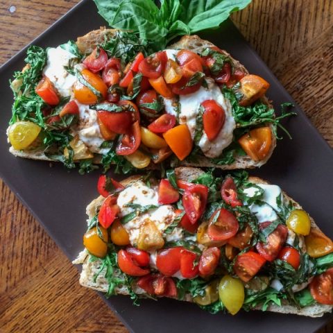 The best bruschetta is a perfect mix of creamy and crunchy. That's why Burrata Bruschetta is the best! Check out my recipe for creamy Burrata Bruschetta!